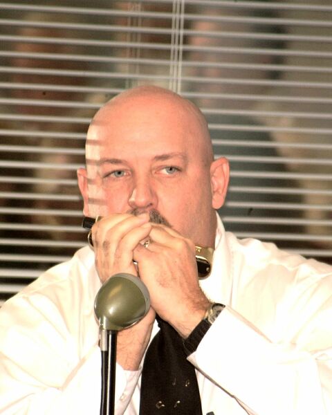 Playing Harmonica at OIT Holiday Concert picture